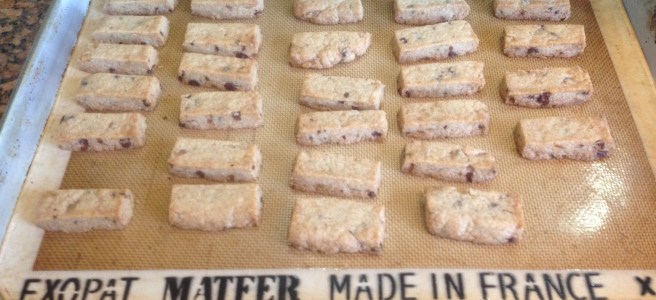completed shortbread finger cookies on a baking sheet with silpat