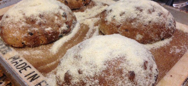 four mini loaves of stollen dusted with sugar
